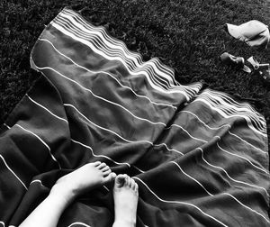 Low section of person lying in water