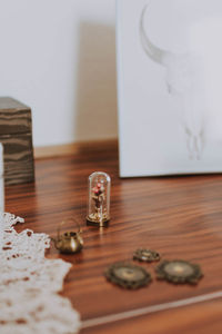 Close-up of wedding rings on table at home