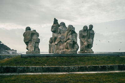 Low angle view of statue against sky