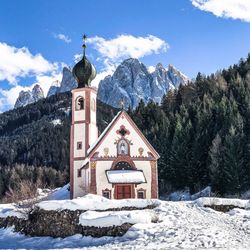 Traditional building against sky during winter