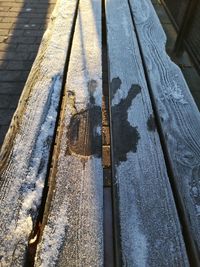 High angle view of cross hanging on wood