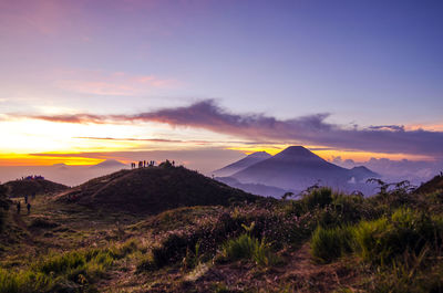 Scenic view of landscape against sky during sunset