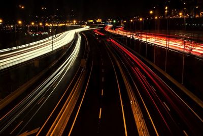 High angle view of light trails on highway at night