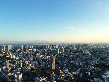 High angle view of city buildings against sky