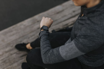 Woman checking fitness watch