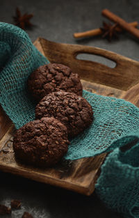 High angle view of chocolate cookies in wooden container