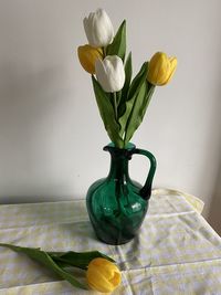 Spring tulips in a green vase