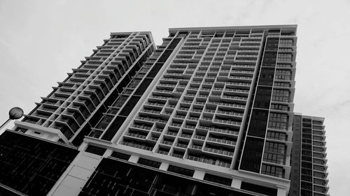 Low angle view of office building against sky