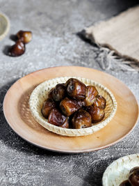 Close-up of dates in plate on table