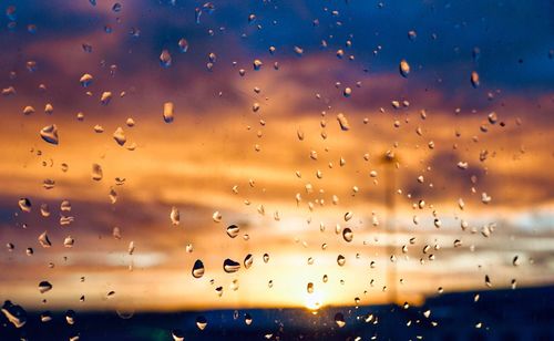 Full frame shot of wet glass window during rainy season