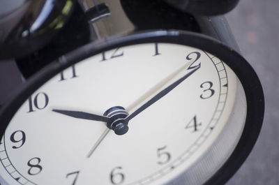 Close-up of alarm clock on table