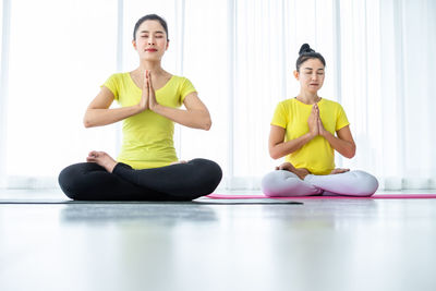 Young woman exercising in gym