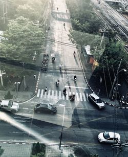 High angle view of vehicles on road in rain
