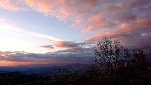 Scenic view of landscape against dramatic sky