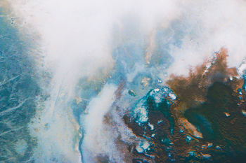 CLOSE-UP OF HUMAN HAND AGAINST THE SKY