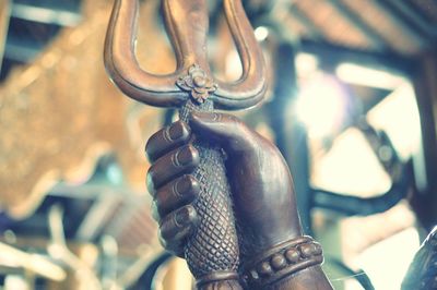 Close-up of chain hanging on metal