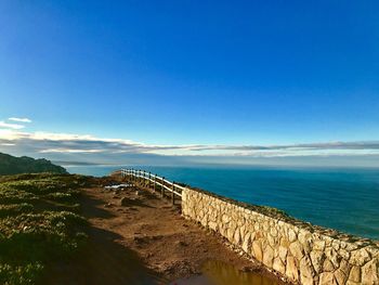 Scenic view of sea against blue sky