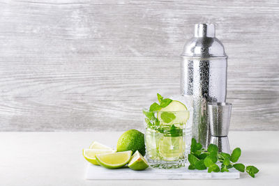 Green fruit on glass table