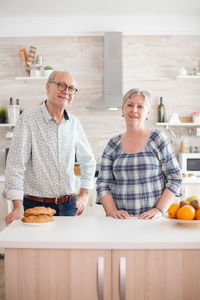 Portrait of couple standing at home