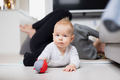 High angle view of cute baby boy sitting on table