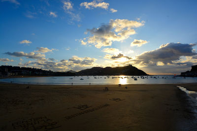 Scenic view of beach against sky during sunset