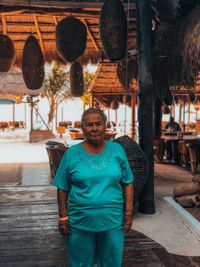 Portrait of woman standing at restaurant