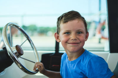 Portrait of boy sitting in car