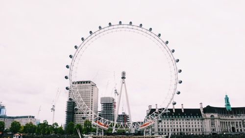 Low angle view of ferris wheel against sky