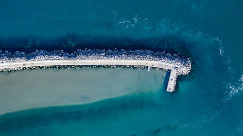 High angle view of groyne by sea