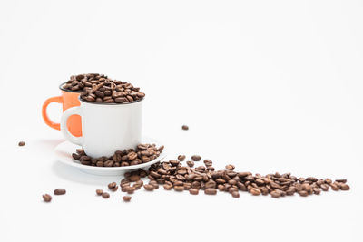 Close-up of coffee beans against white background