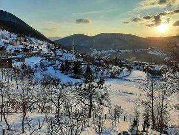 Scenic view of snowcapped mountains against sky during winter