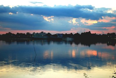 Scenic view of lake against sky at sunset