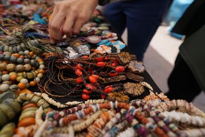 Midsection of person for sale at market stall