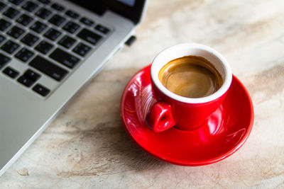 High angle view of coffee cup on table