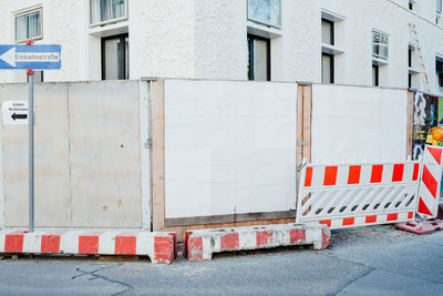 Barricades on street against building