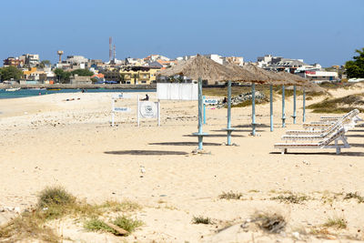 Sunshades and lounge chairs on beach