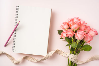 High angle view of pink flower on table