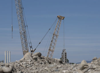 Construction crane in building industry, heavy machine at construction site