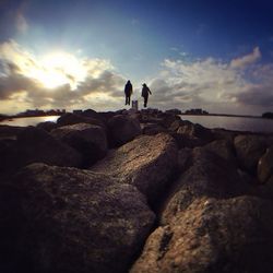 People standing on rock formation