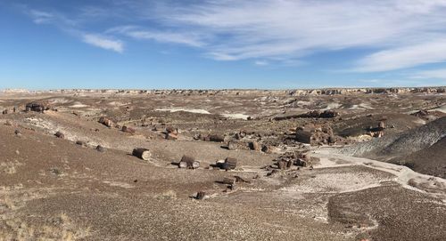 Scenic view of arid landscape against sky