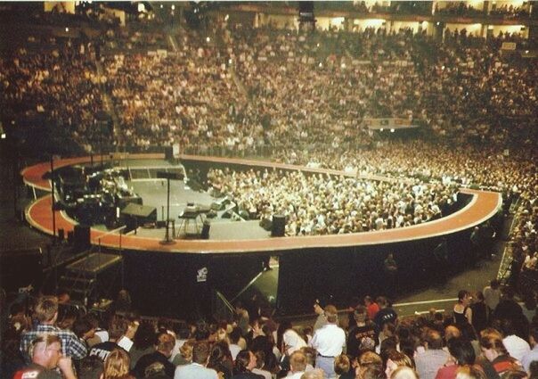 large group of people, crowd, men, person, lifestyles, illuminated, leisure activity, high angle view, night, chair, abundance, sitting, indoors, lighting equipment, stadium, togetherness, relaxation, arts culture and entertainment