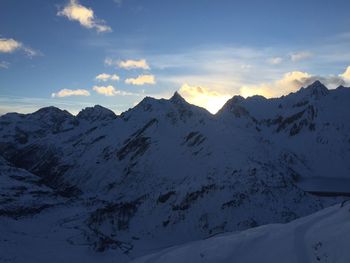 Scenic view of snowcapped mountains against sky