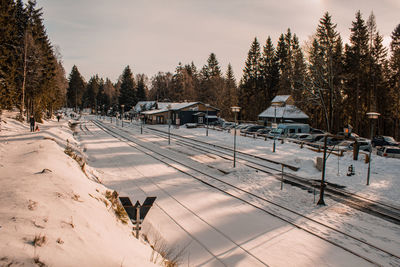 Snow covered land against sky