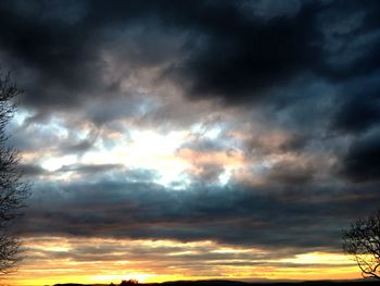 Low angle view of dramatic sky during sunset