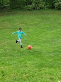 Dedicated young boy enjoying practicing soccer skills on a beautiful summer day in delton michigan