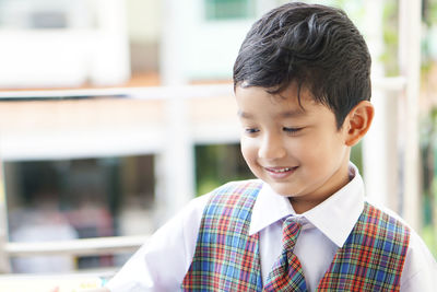 Close-up portrait of smiling boy