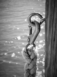 Close-up of rope tied on wooden post