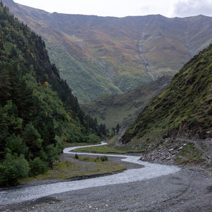 Scenic view of road amidst mountains
