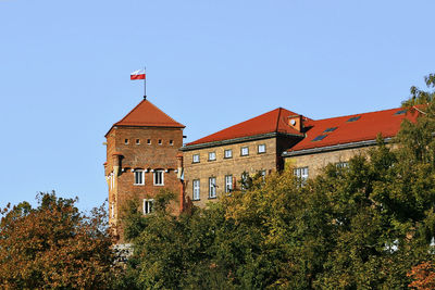 Low angle view of buildings against clear sky