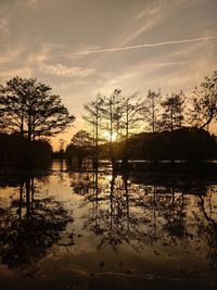 Scenic view of lake against sky during sunset